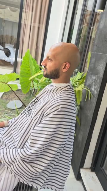 Client with a freshly shaped beard during a home visit