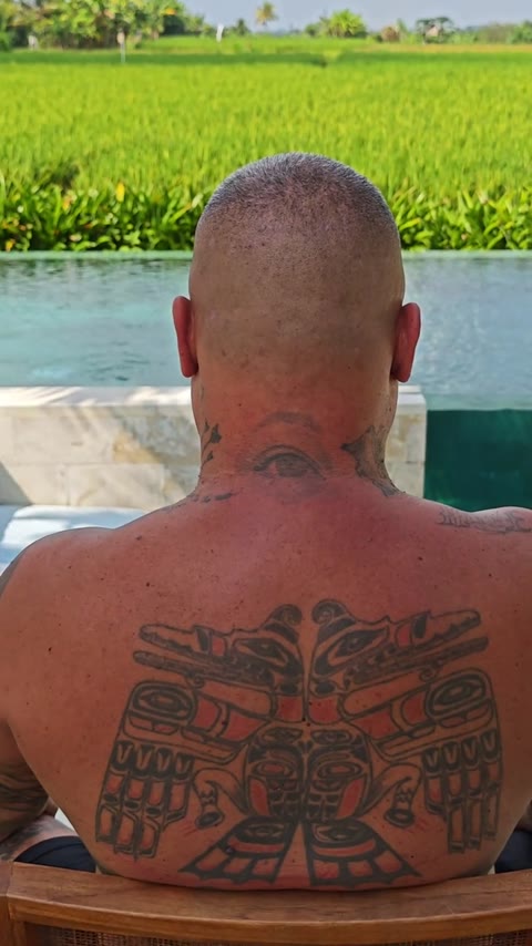 Close-cropped haircut at a poolside villa