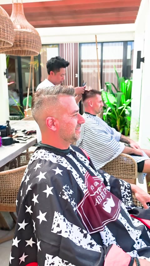 Clients enjoying haircuts at a villa in Bali
